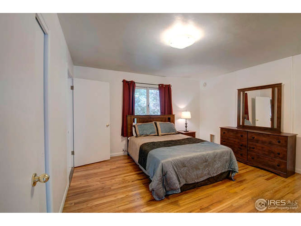 751 Gapter Road Boulder, CO 80303 - Photo 10 of 24 a bedroom with a bed and a dresser