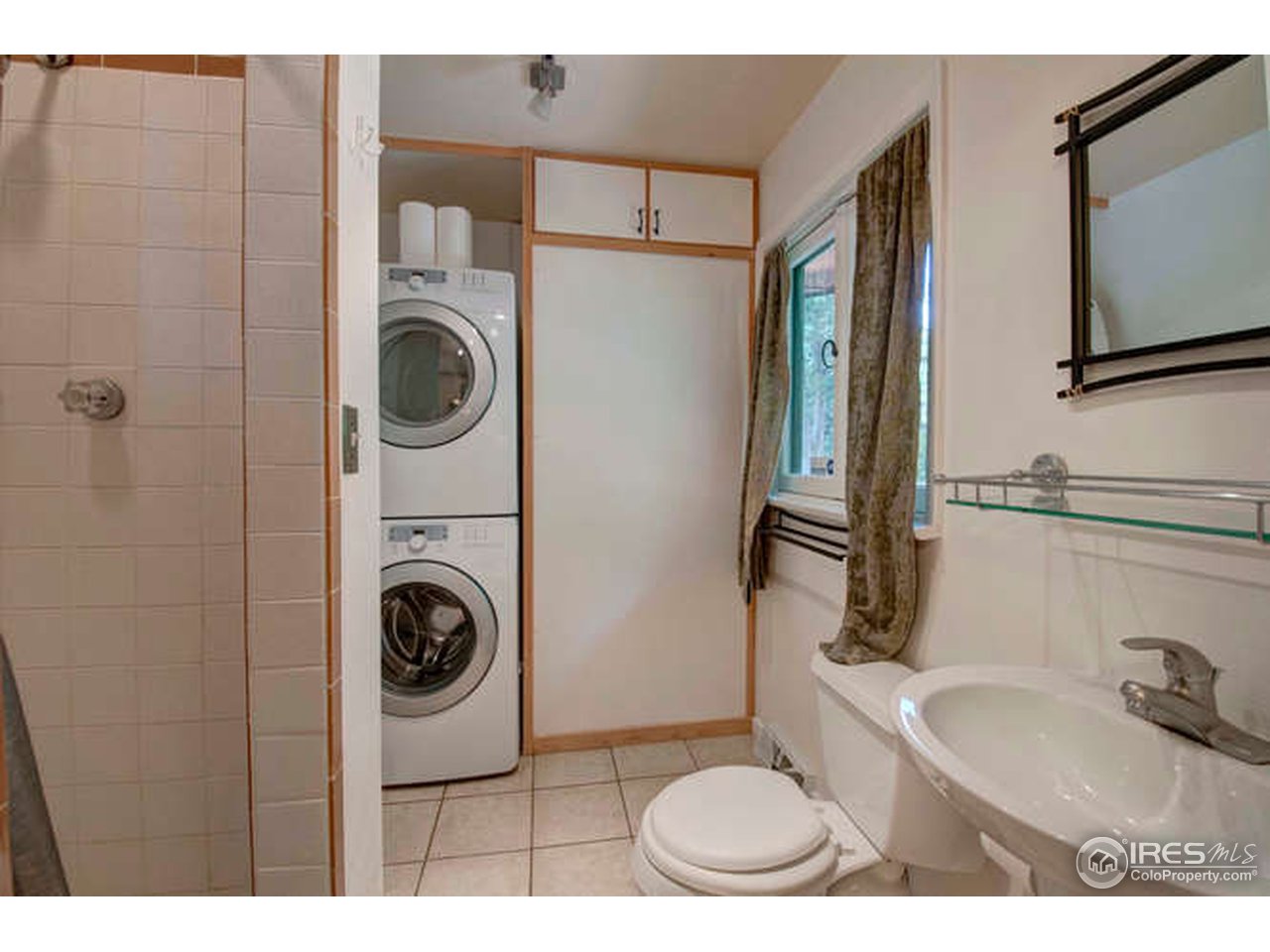 751 Gapter Road Boulder, CO 80303 - Photo 12 of 24 a bathroom with a toilet mirror and a sink