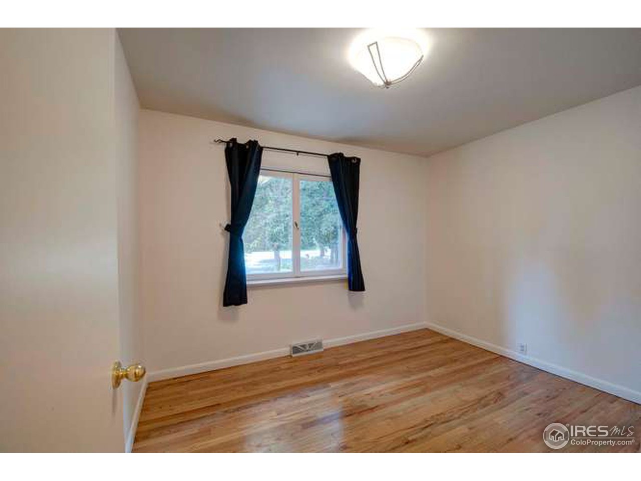 751 Gapter Road Boulder, CO 80303 - Photo 13 of 24 a view of an empty room with a window