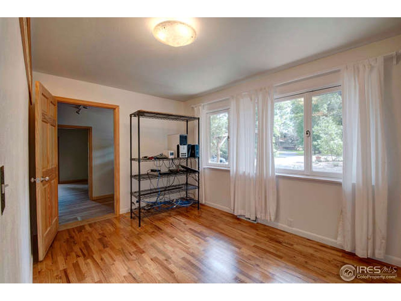 751 Gapter Road Boulder, CO 80303 - Photo 14 of 24 a view of empty room with wooden floor