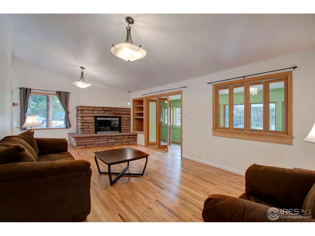 751 Gapter Road Boulder, CO 80303 - Photo 2 of 24 a living room with furniture and a flat screen tv