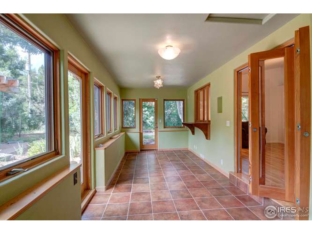 751 Gapter Road Boulder, CO 80303 - Photo 4 of 24 a hallway with a large window and kitchen view