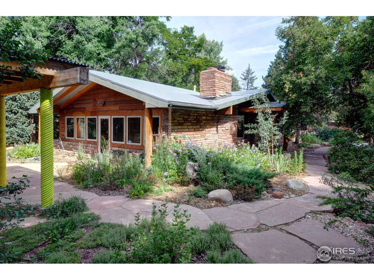 751 Gapter Road Boulder, CO 80303 - Photo 5 of 24 a front view of a house with a yard