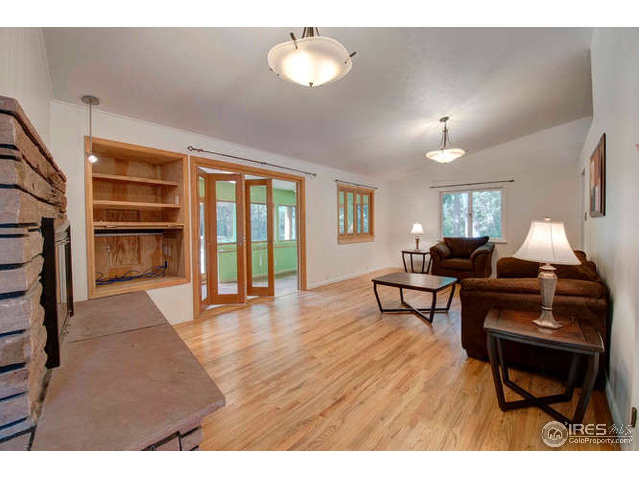 751 Gapter Road Boulder, CO 80303 - Photo 6 of 24 a living room with furniture and a fireplace