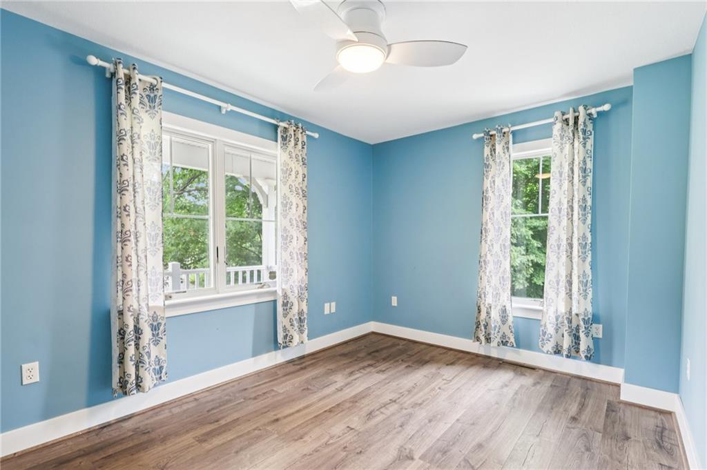 3442 Mercer Road New Castle, PA 16105 - Photo 15 of 39 a view of empty room with wooden floor and fan