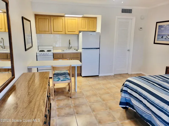 a bedroom with a bed and a cabinets