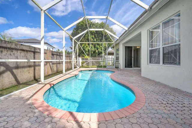 a view of a swimming pool with an outdoor space