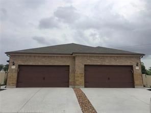 351 Joanne Loop, Unit A Buda, TX 78610 - Photo 1 of 17 A spacious double garage complements this home's attractive brick facade.