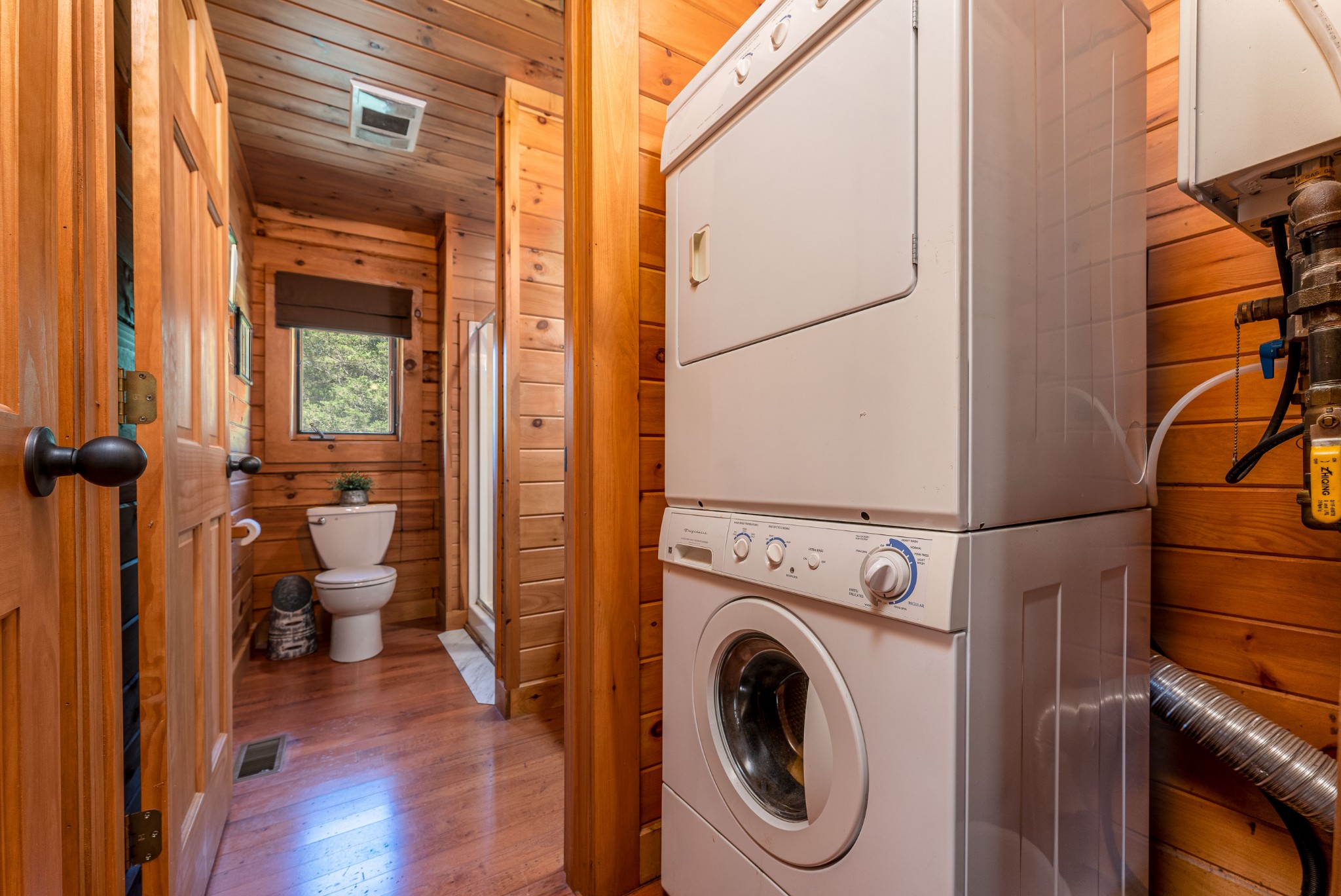 5700 Almaville Road Smyrna, TN 37167 - Photo 19 of 26 a view of a hallway with a washer and dryer on a bookshelf