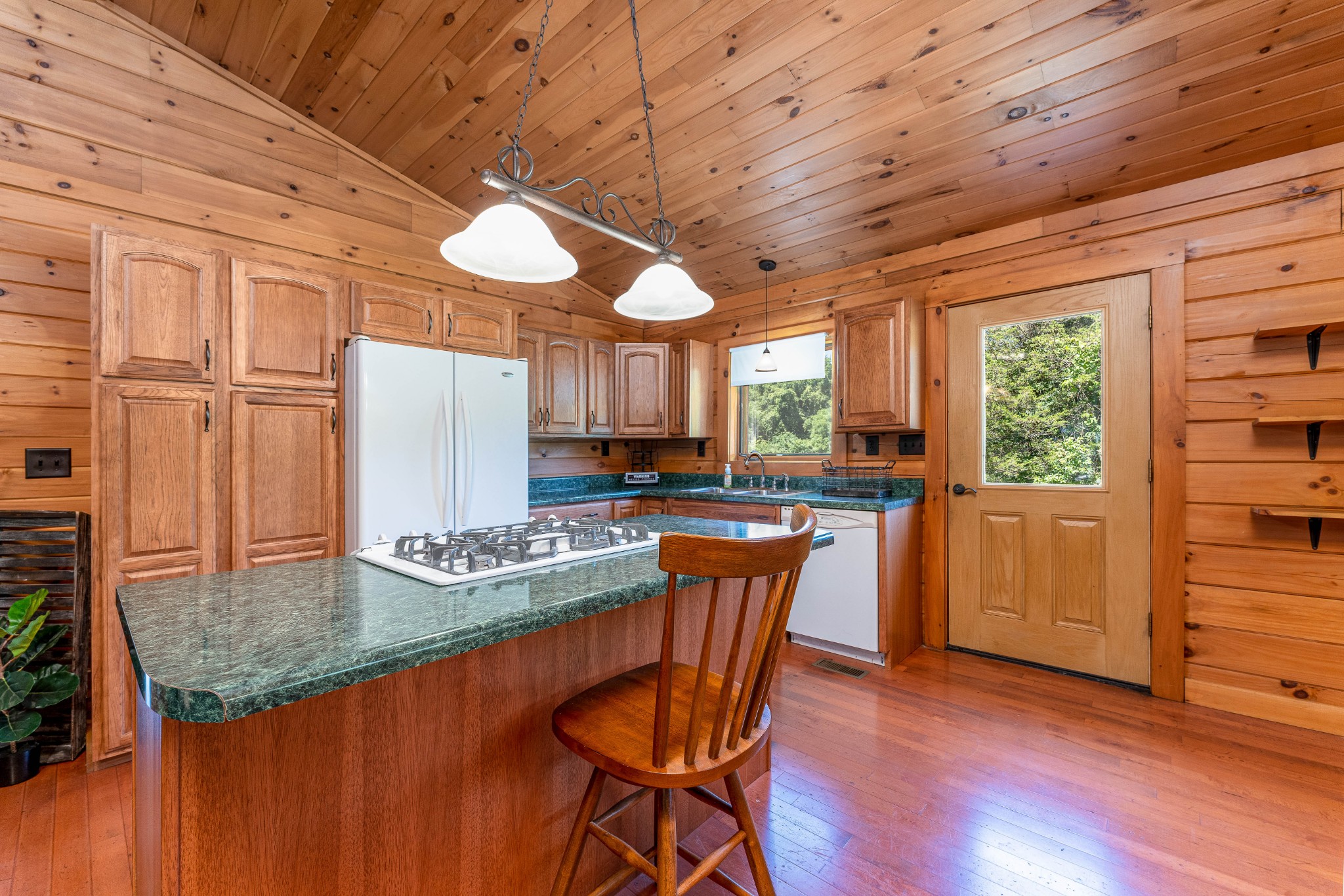 5700 Almaville Road Smyrna, TN 37167 - Photo 8 of 26 a kitchen with stainless steel appliances granite countertop a stove a refrigerator a dining table and chairs with wooden floor