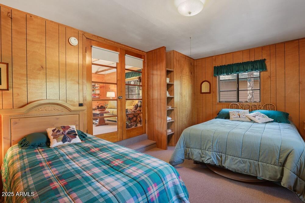 287 South Lookout Trail Payson, AZ 85541 - Photo 18 of 32 a bedroom with a bed and a dresser next to a window