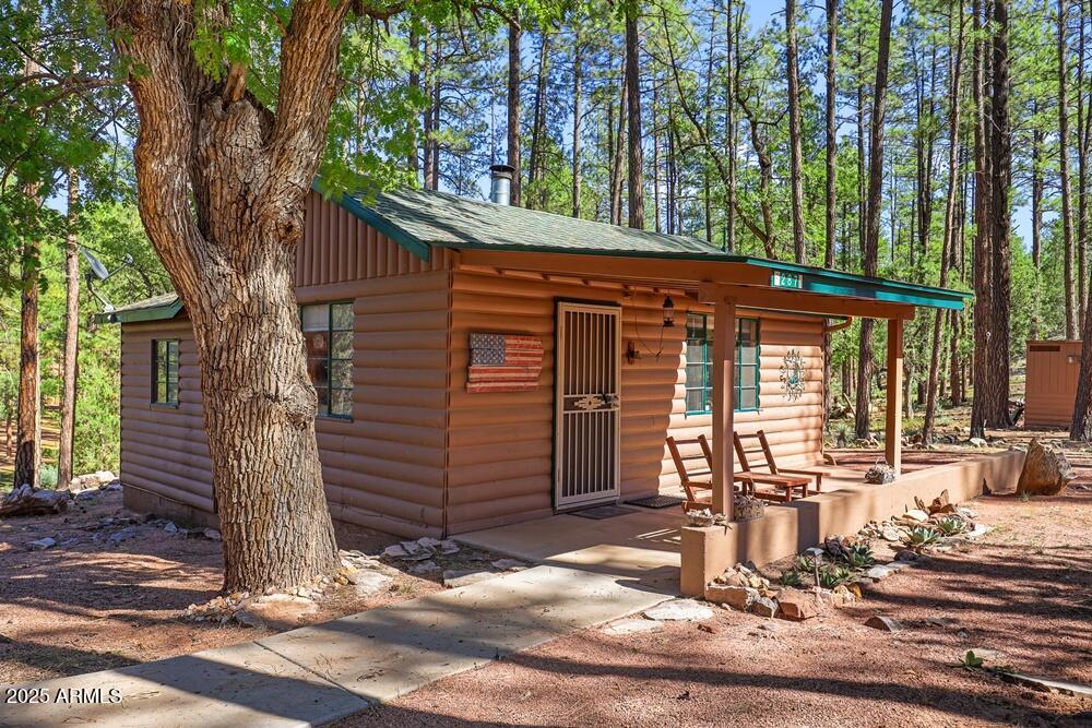 287 South Lookout Trail Payson, AZ 85541 - Photo 4 of 32 a front view of a house with a tree