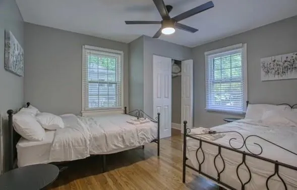 a bedroom with a bed and a window