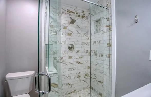 a bathroom with a shower and a toilet