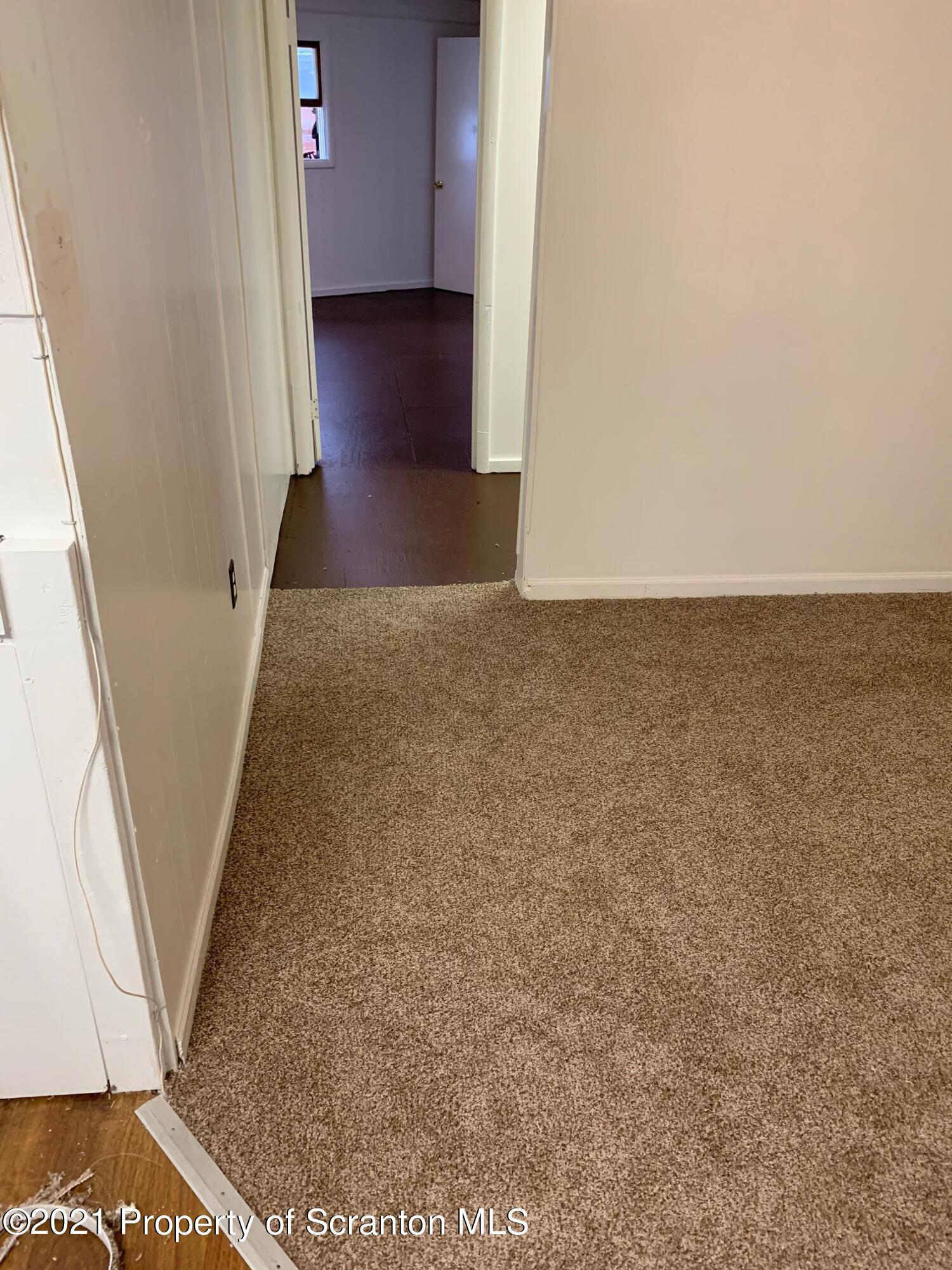 42 Fallbrook Street Carbondale, PA 18407 - Photo 13 of 41 a view of a hallway with wooden floor