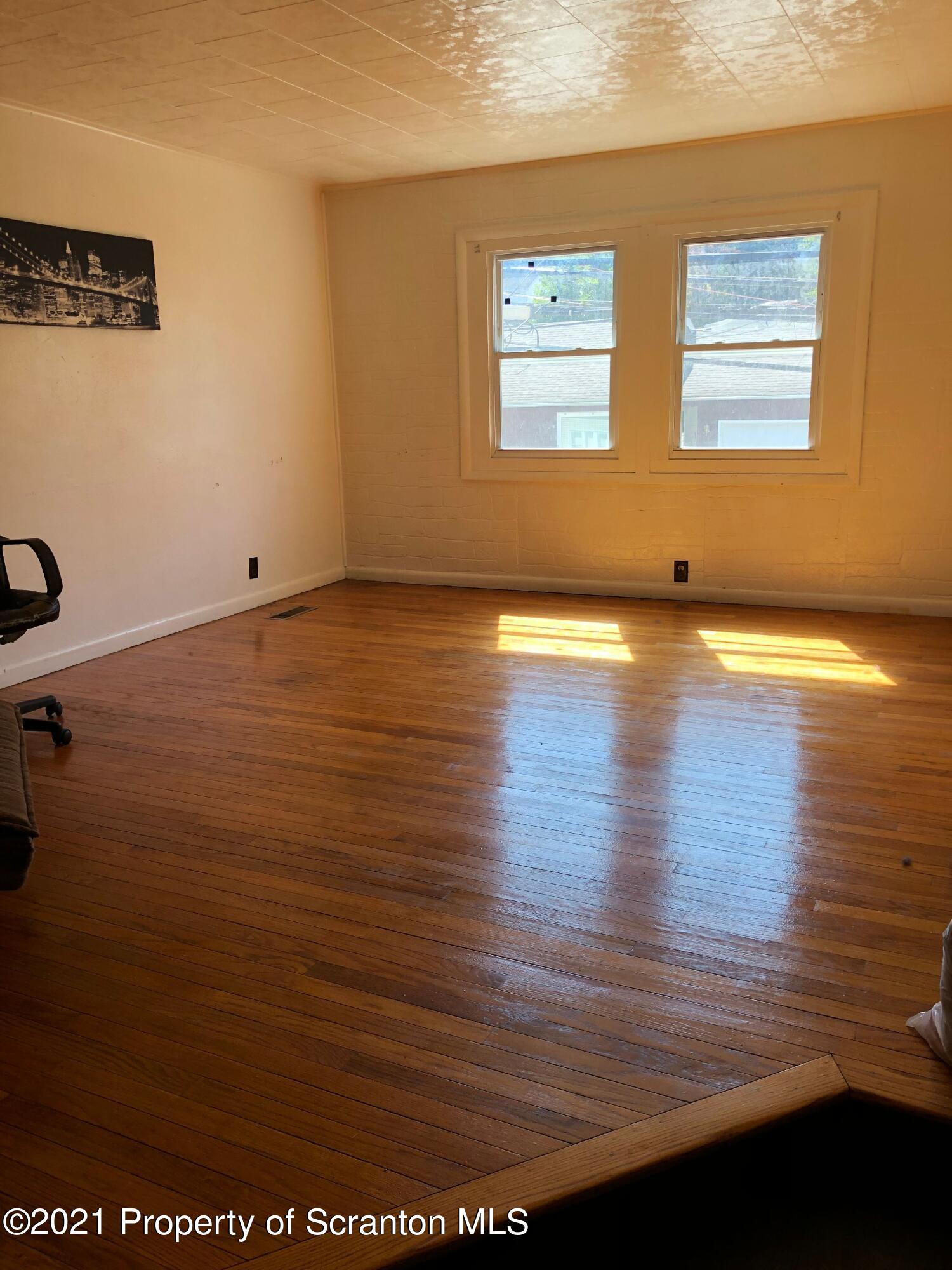 42 Fallbrook Street Carbondale, PA 18407 - Photo 21 of 41 a view of empty room with wooden floor