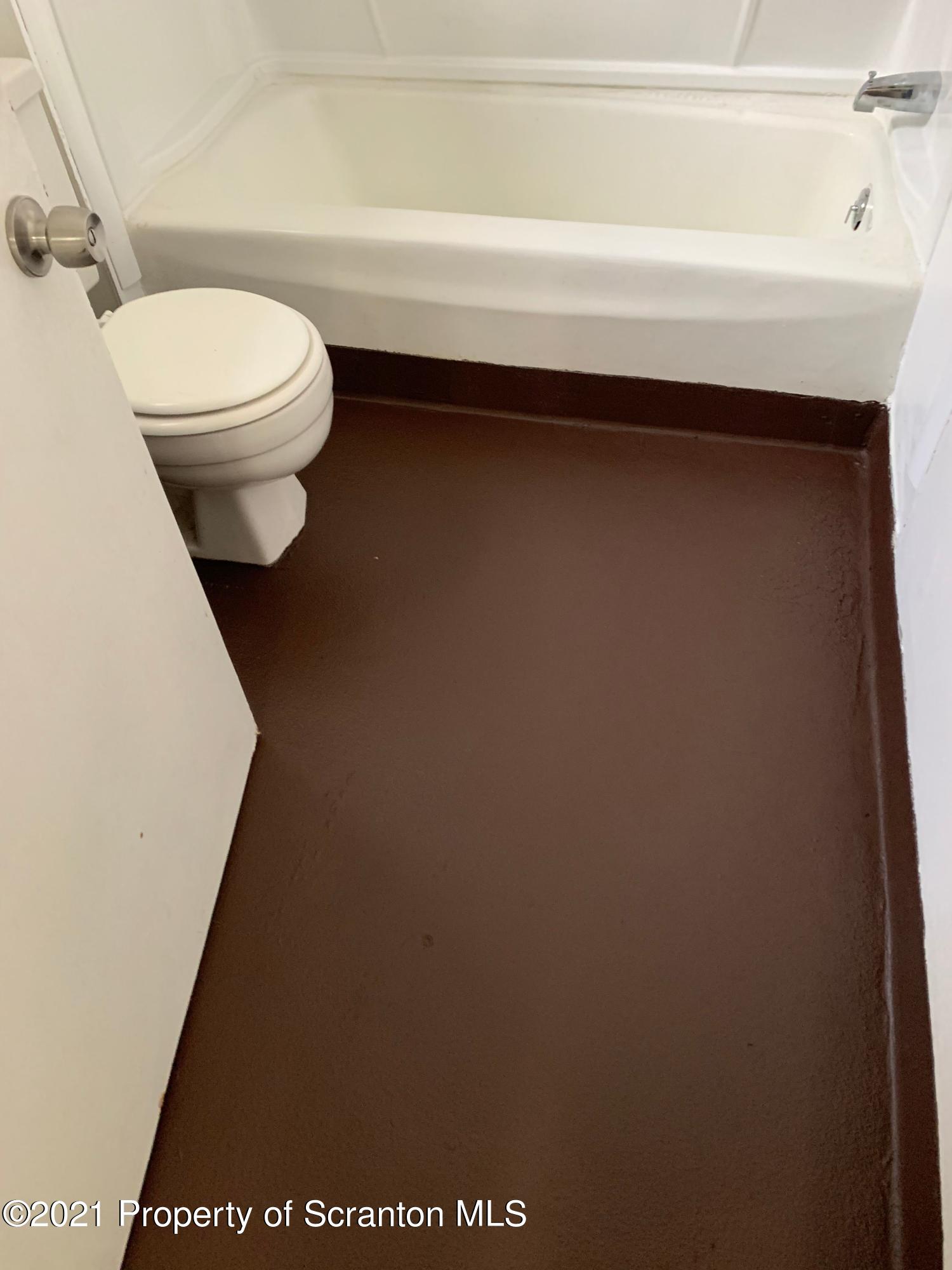 42 Fallbrook Street Carbondale, PA 18407 - Photo 26 of 41 a bathroom with a toilet and a sink