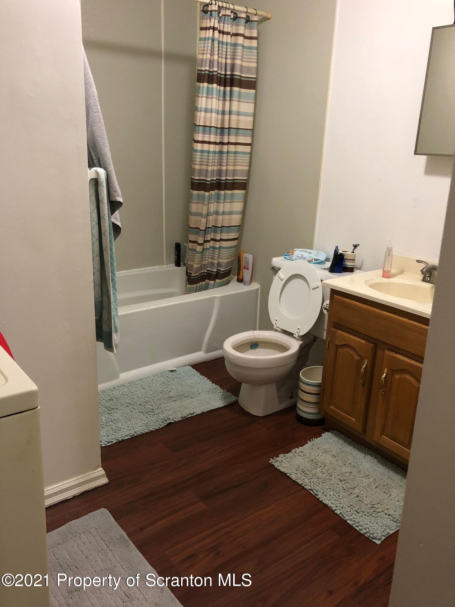 42 Fallbrook Street Carbondale, PA 18407 - Photo 10 of 41 a spacious bathroom with a granite countertop toilet a sink and a bathtub