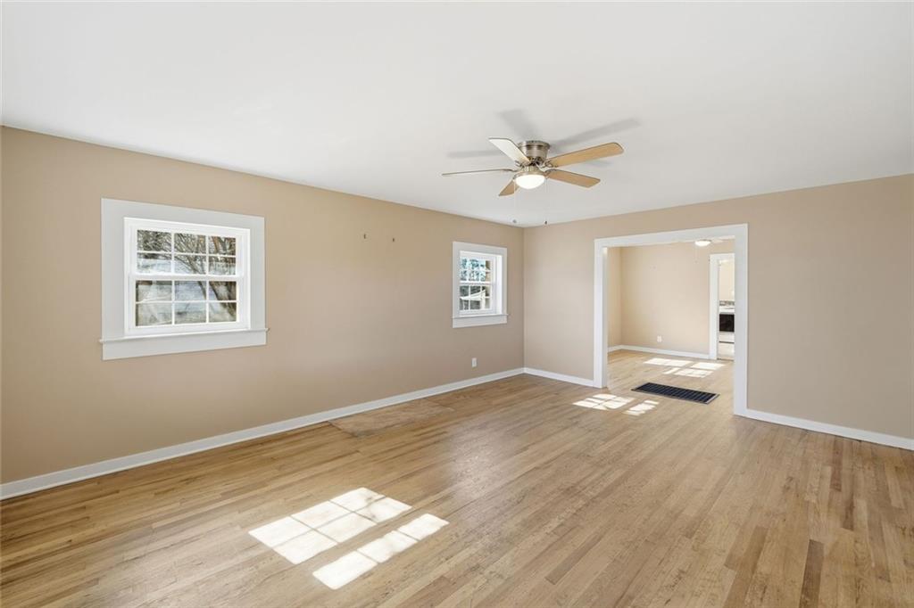 3418 Refuge Road Jasper, GA 30143 - Photo 14 of 55 a view of empty room with wooden floor and fan