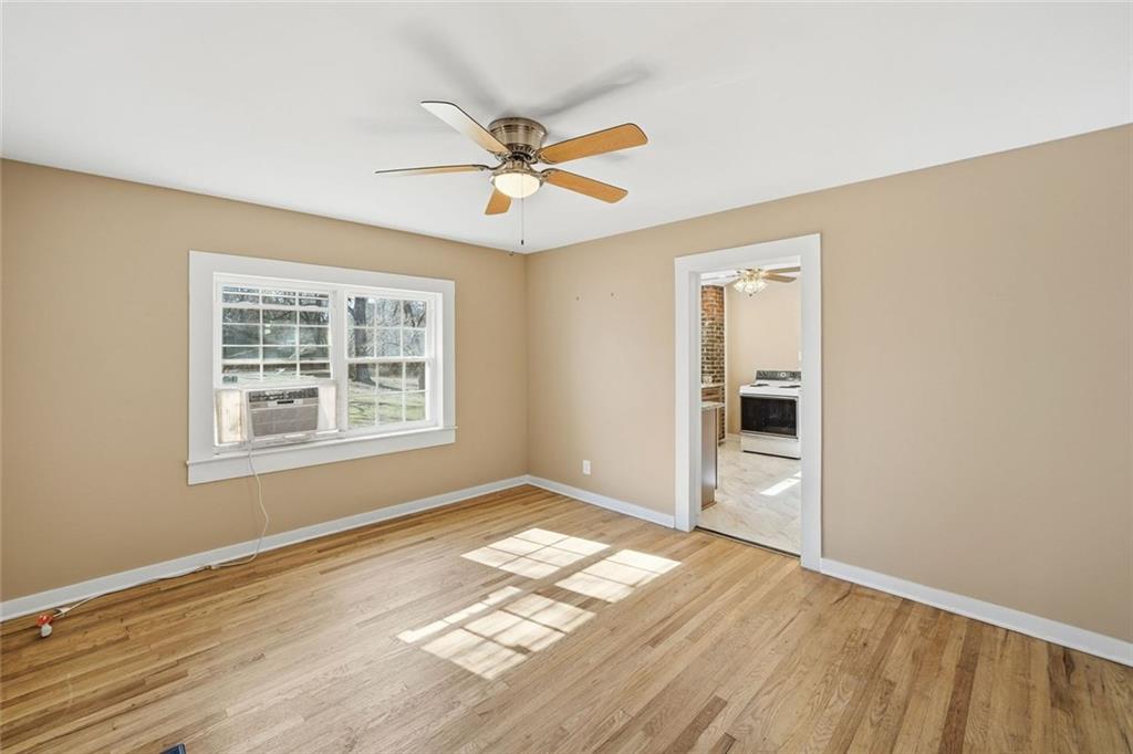 3418 Refuge Road Jasper, GA 30143 - Photo 15 of 55 a view of empty room with wooden floor and fan