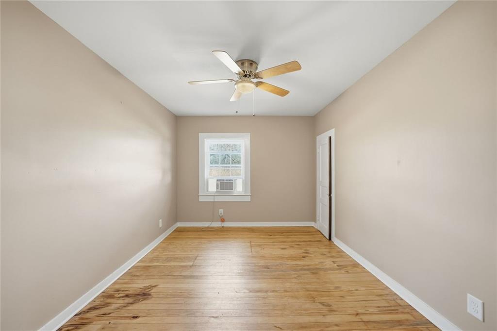 3418 Refuge Road Jasper, GA 30143 - Photo 17 of 55 wooden floor in an empty room with a window