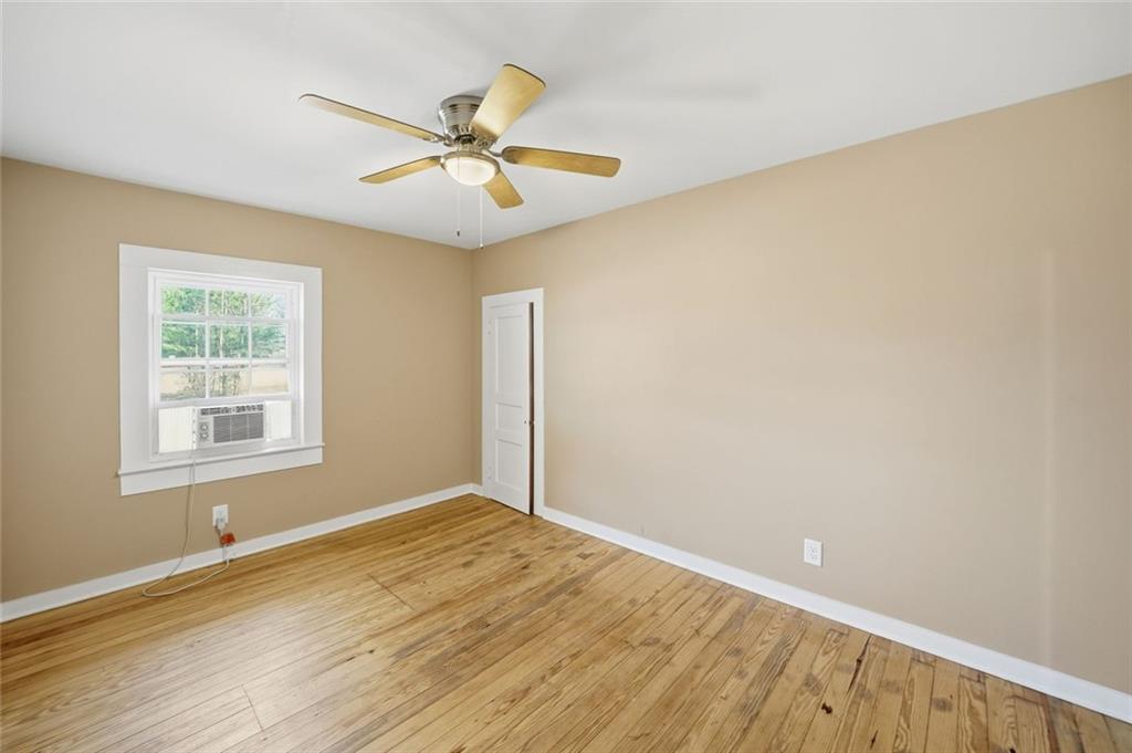 3418 Refuge Road Jasper, GA 30143 - Photo 18 of 55 a view of an empty room with wooden floor and a window