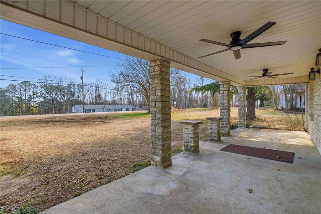 3418 Refuge Road Jasper, GA 30143 - Photo 31 of 55 a view of a livingroom with wooden floor and a ceiling fan