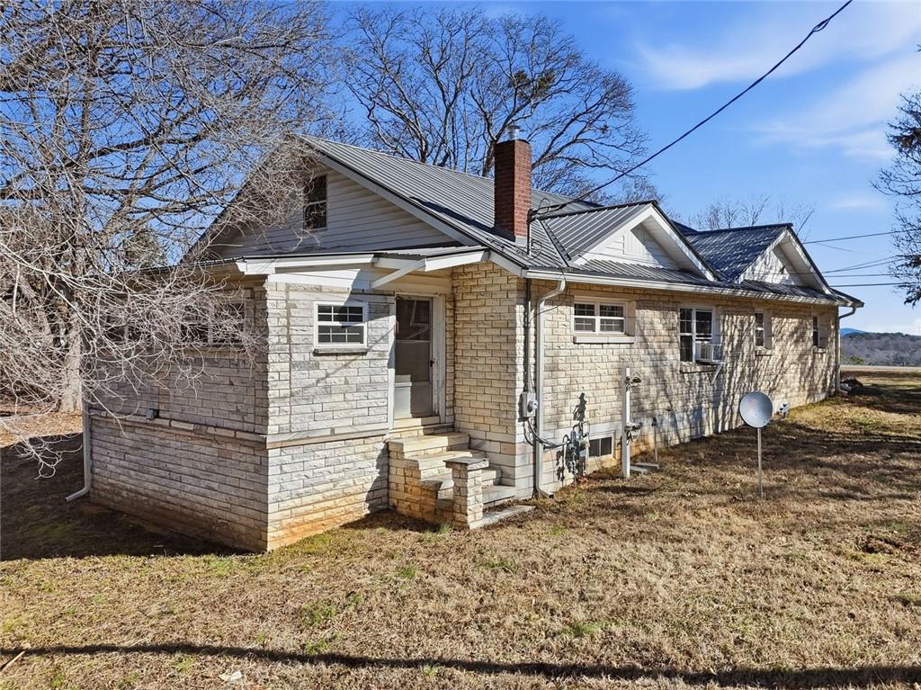 3418 Refuge Road Jasper, GA 30143 - Photo 38 of 55 a front view of a house with garden