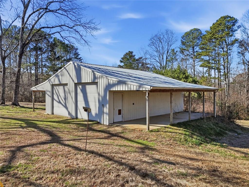3418 Refuge Road Jasper, GA 30143 - Photo 4 of 55 a house with trees in the background