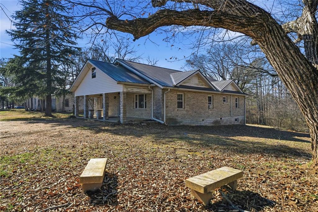 3418 Refuge Road Jasper, GA 30143 - Photo 46 of 55 a view of a house with a yard and sitting area