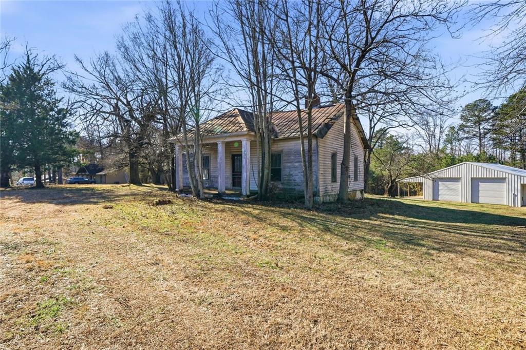 3418 Refuge Road Jasper, GA 30143 - Photo 47 of 55 a view of a house with a yard covered in snow