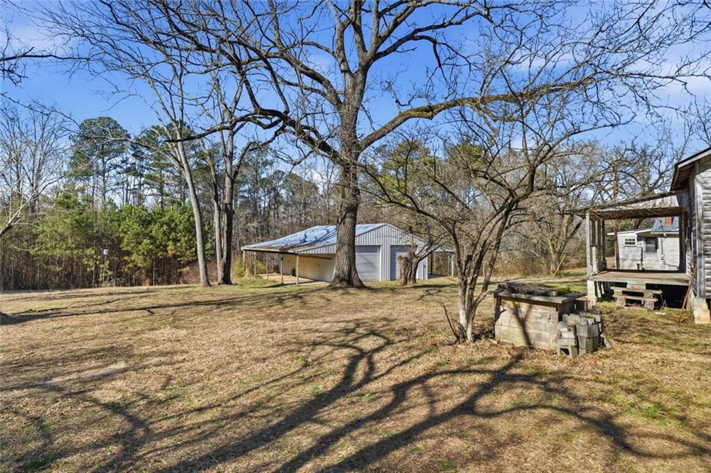 3418 Refuge Road Jasper, GA 30143 - Photo 48 of 55 a view of a yard covered with snow in front of house