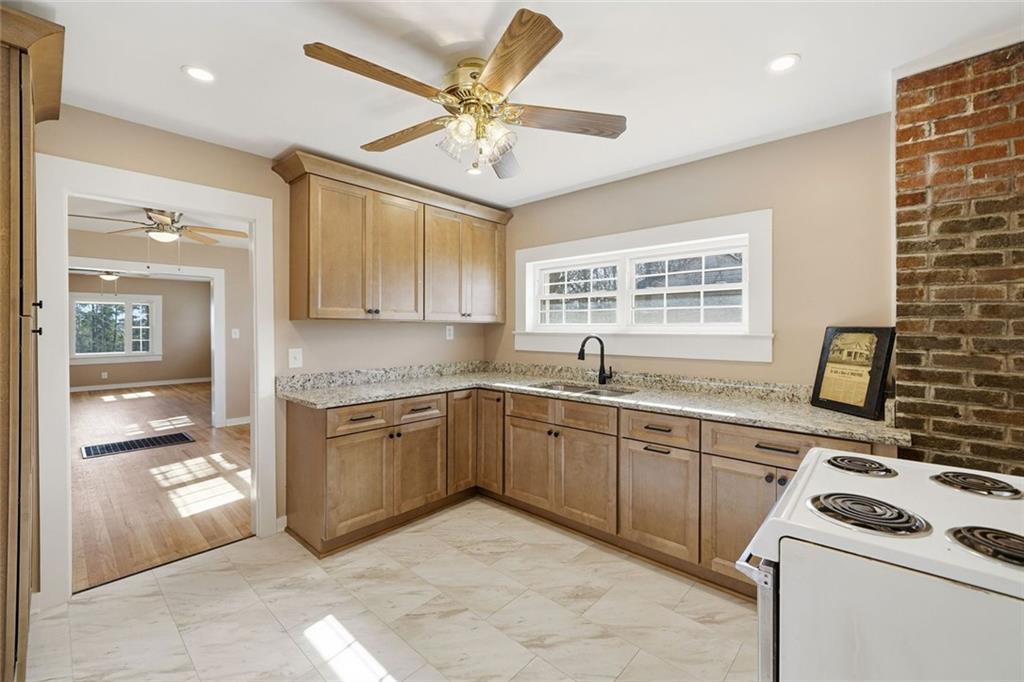 3418 Refuge Road Jasper, GA 30143 - Photo 8 of 55 a kitchen with a sink cabinets and window