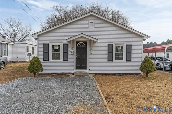 a view of a house with a yard and garage