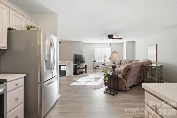 a kitchen with stainless steel appliances a refrigerator sink and cabinets