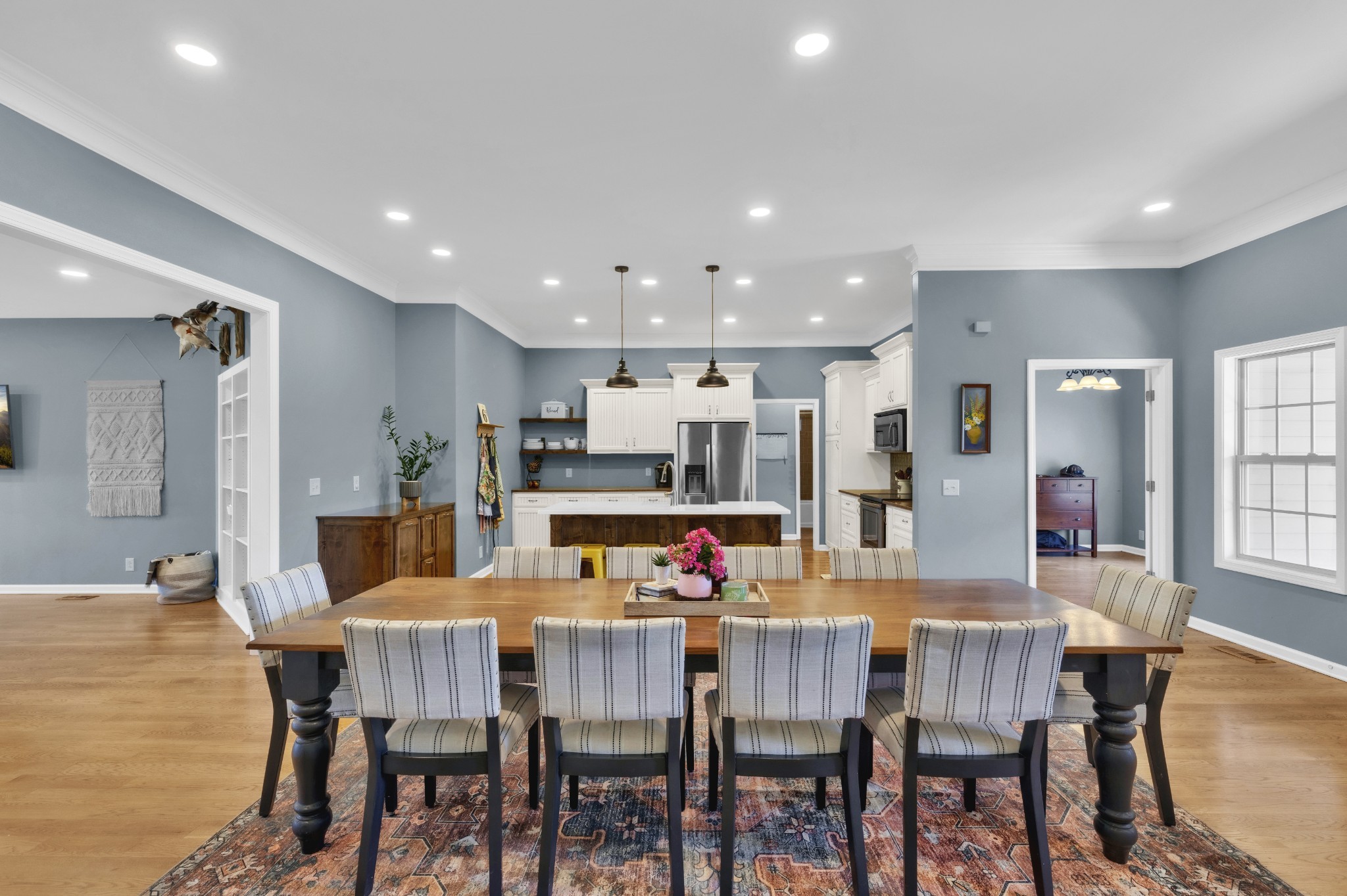 3988 Fykes Grove Road Cedar Hill, TN 37032 - Photo 18 of 50 a dining room with kitchen island a dining table and chairs