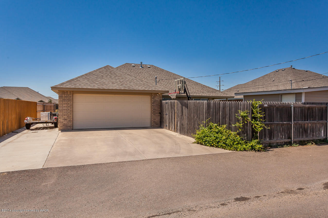 5811 South Rusk Street Amarillo, TX 79118 - Photo 21 of 22 a front view of a house with garden