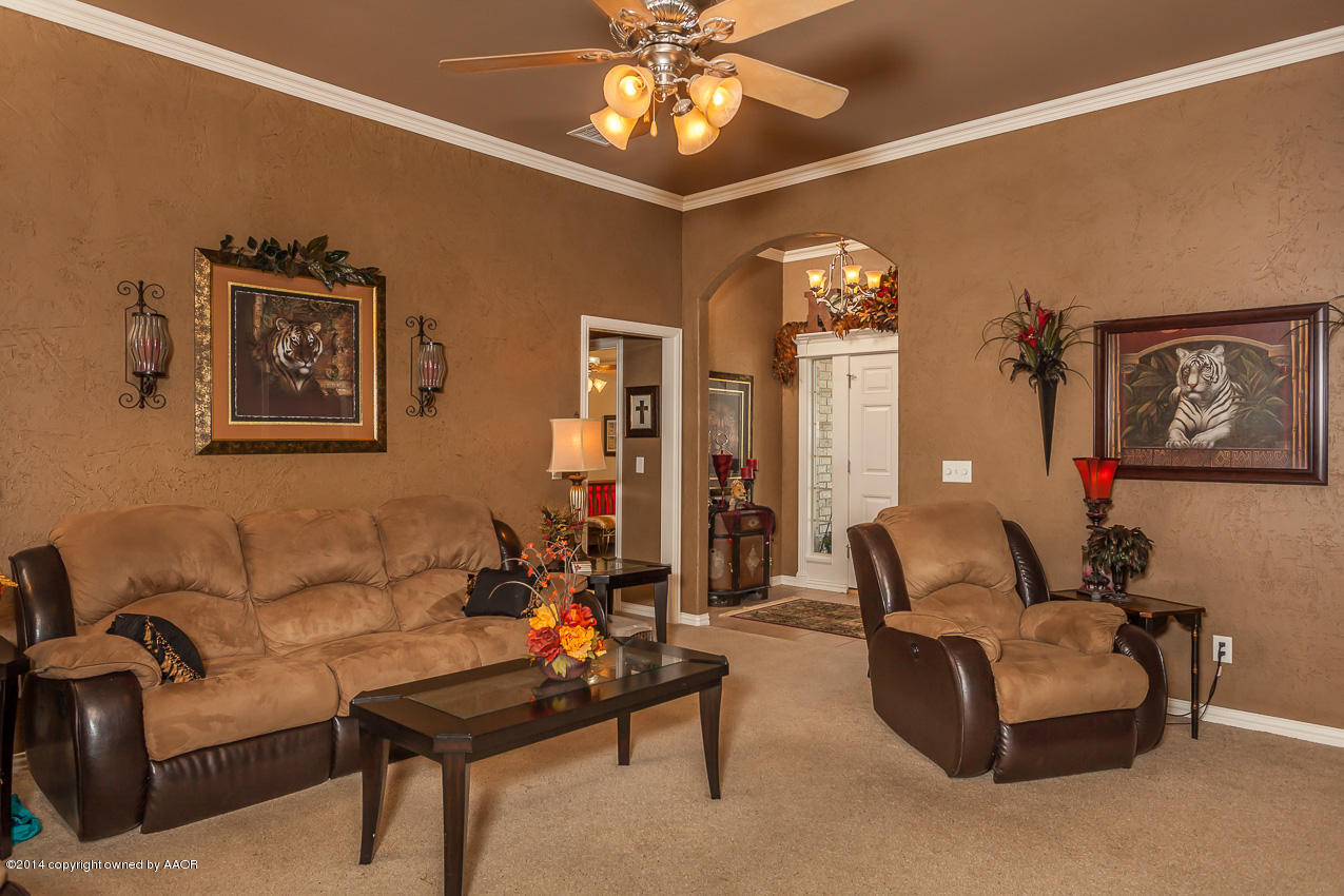 5811 South Rusk Street Amarillo, TX 79118 - Photo 4 of 22 a living room with furniture and chandelier