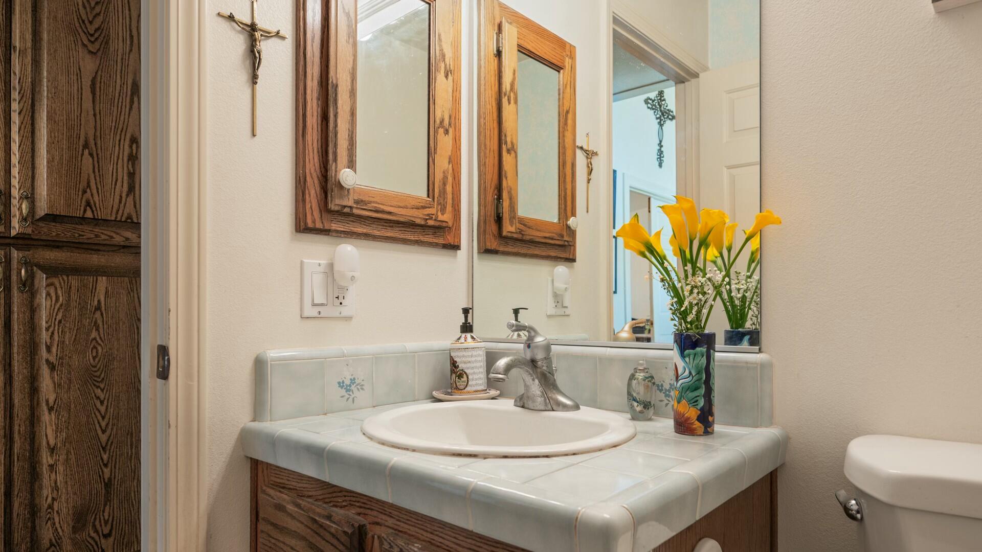 34 Cambridge Drive Lompoc, CA 93436 - Photo 13 of 26 a bathroom with a sink a toilet and a mirror