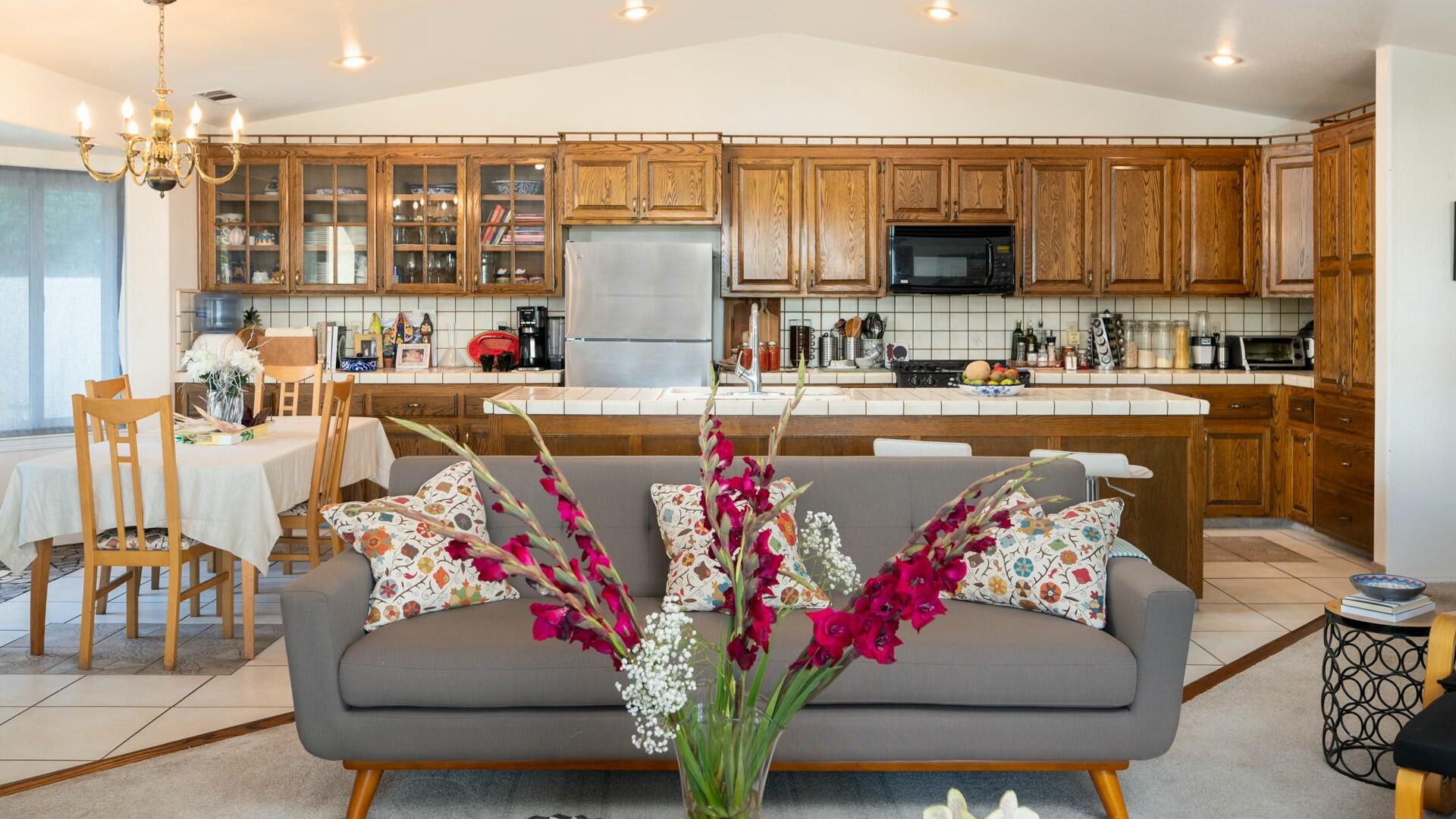 34 Cambridge Drive Lompoc, CA 93436 - Photo 6 of 26 a living room with furniture flowerpot and a kitchen view