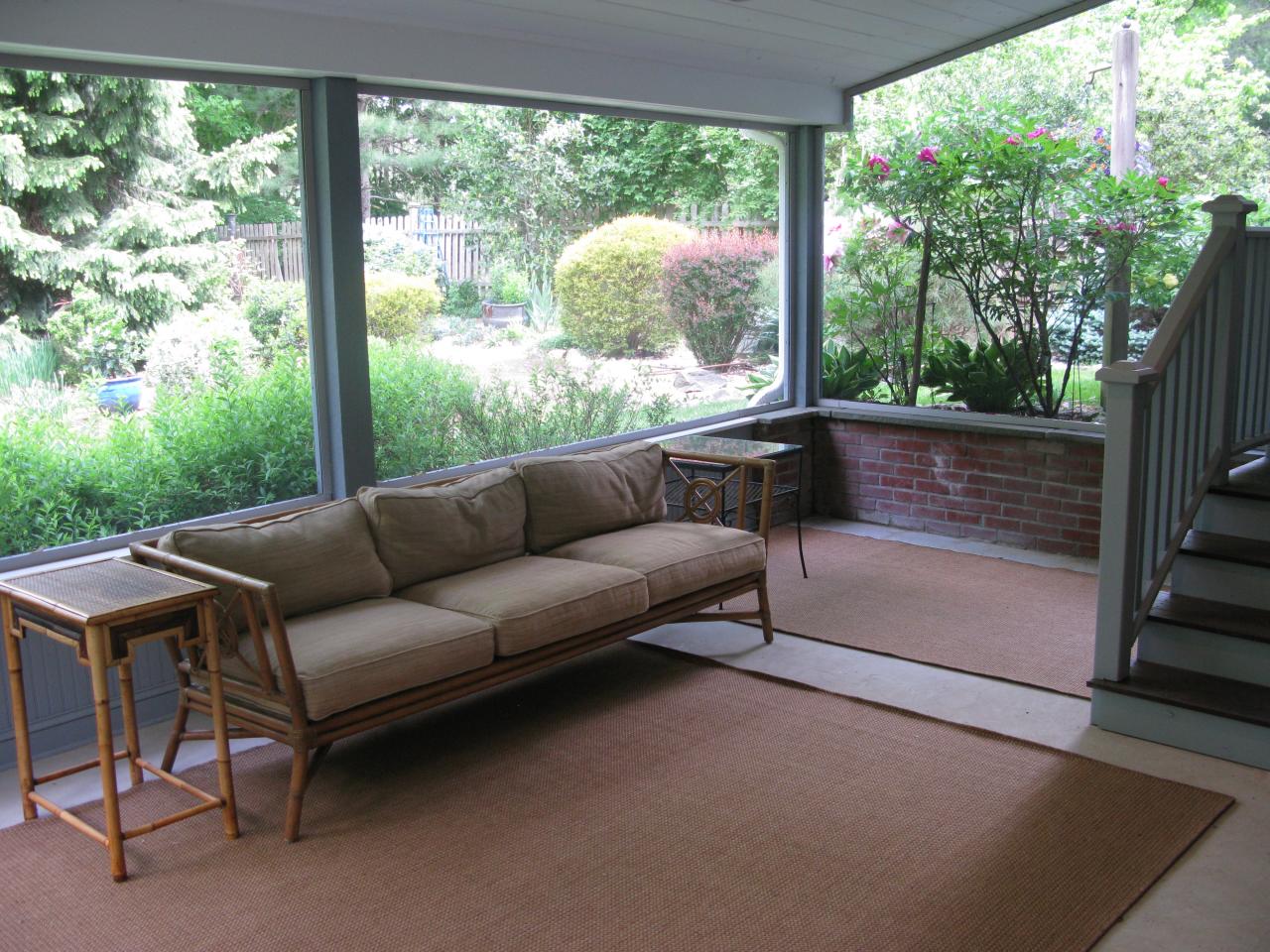 336 Ponus Ridge Road New Canaan, CT 06840 - Photo 19 of 28 a balcony with furniture and a garden