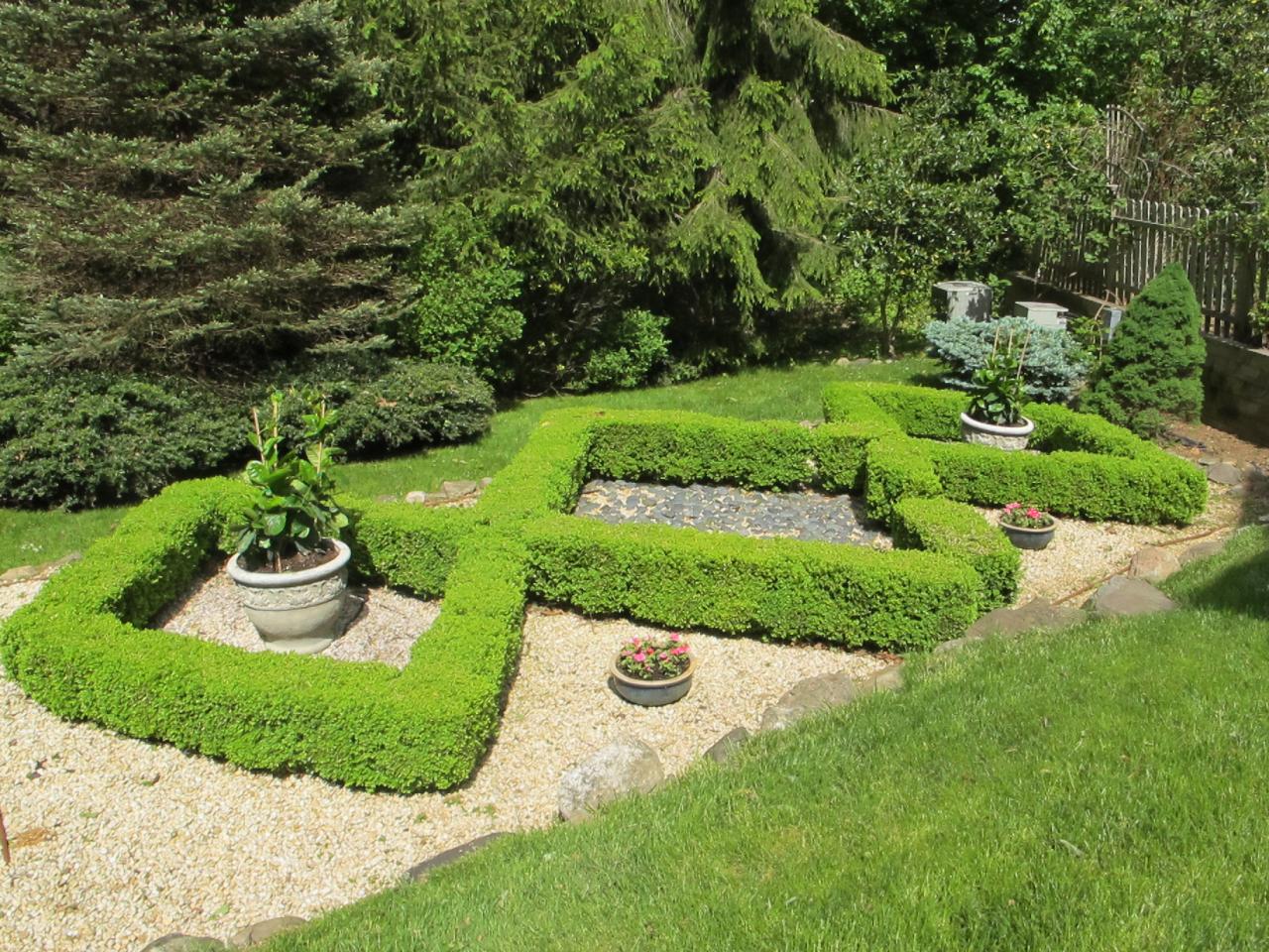 336 Ponus Ridge Road New Canaan, CT 06840 - Photo 23 of 28 a view of a garden with a fountain