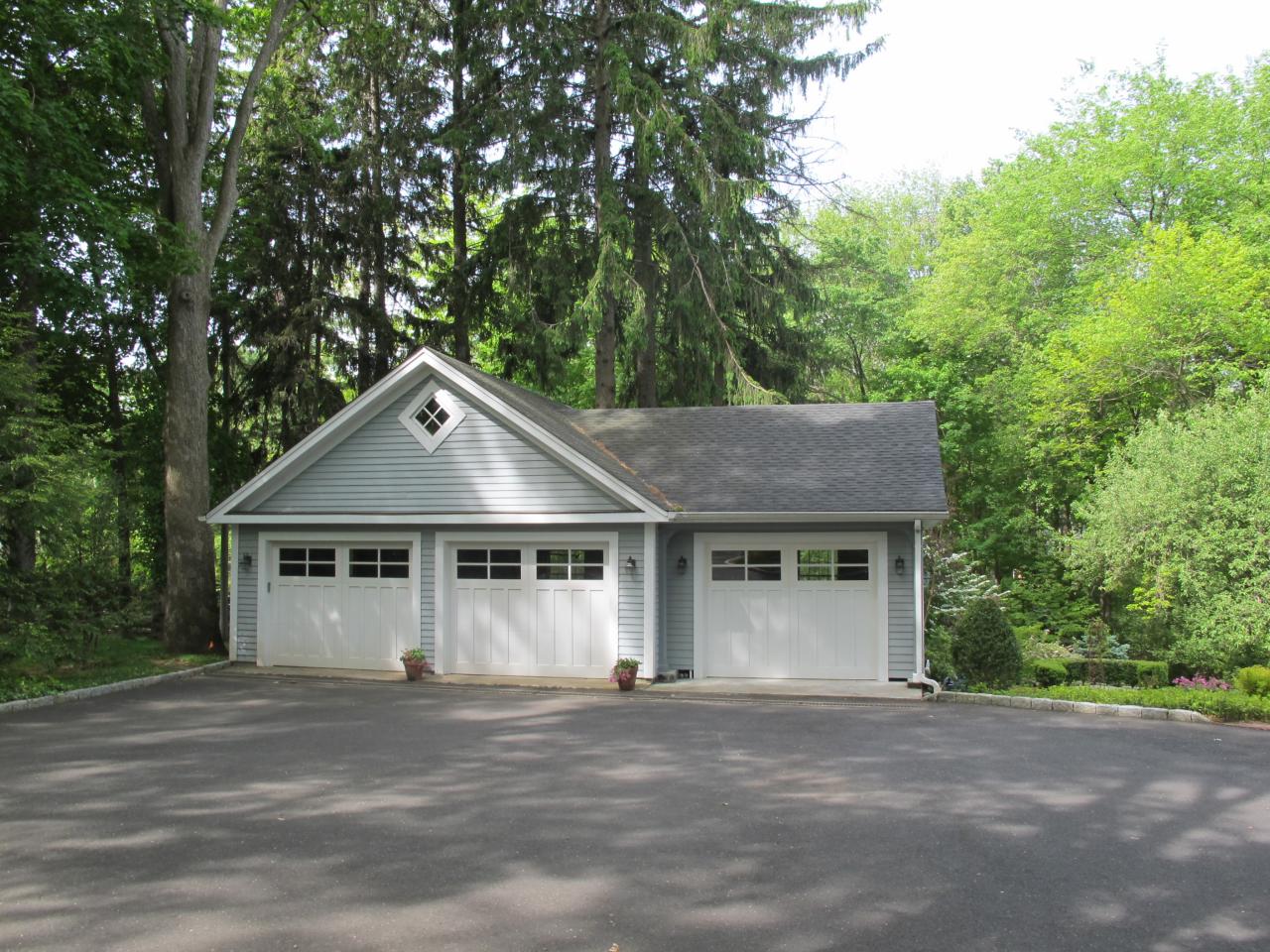 336 Ponus Ridge Road New Canaan, CT 06840 - Photo 27 of 28 a house with trees in the background