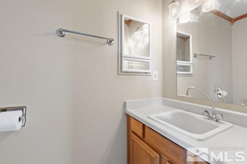 926 University Place Reno, NV 89512 - Photo 17 of 30 a bathroom with a sink and a mirror