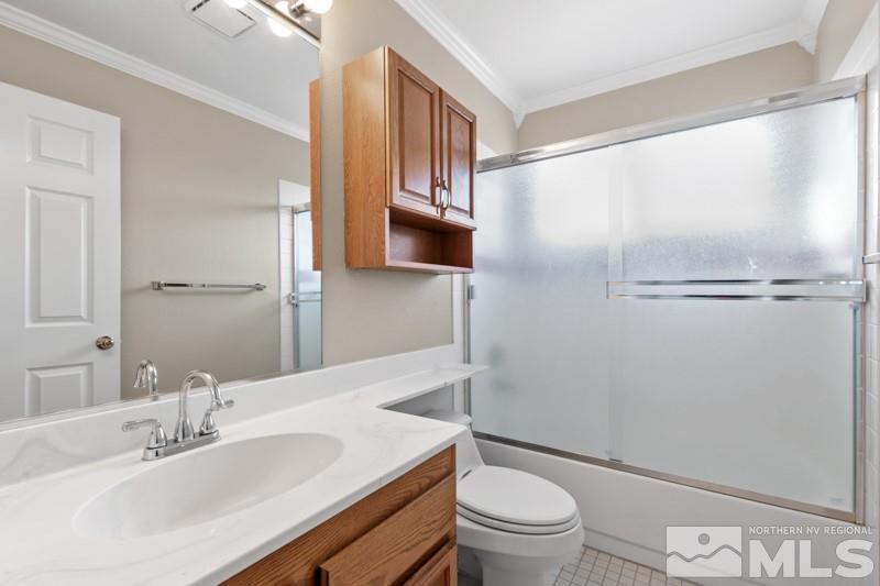 926 University Place Reno, NV 89512 - Photo 22 of 30 a bathroom with a sink a toilet and shower