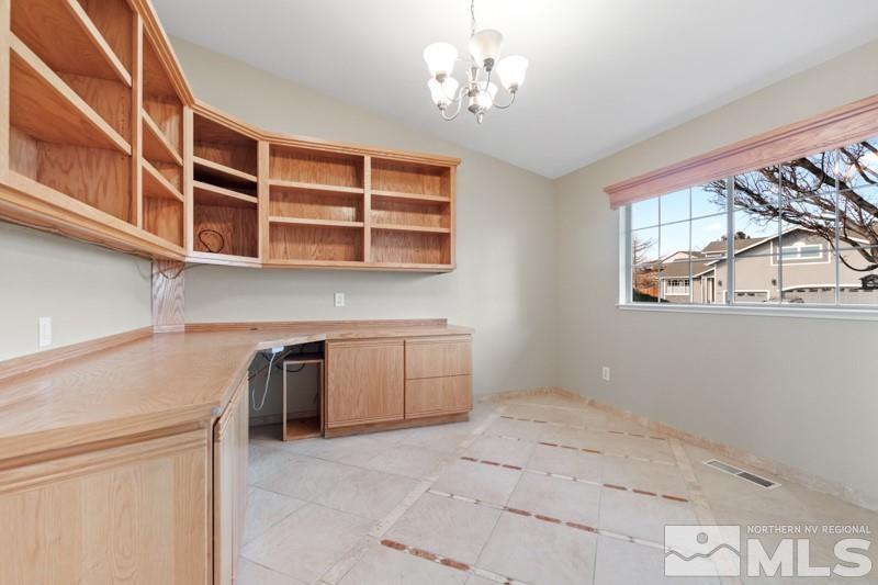 926 University Place Reno, NV 89512 - Photo 8 of 30 a view of a kitchen with a dishwasher cabinets and a large window