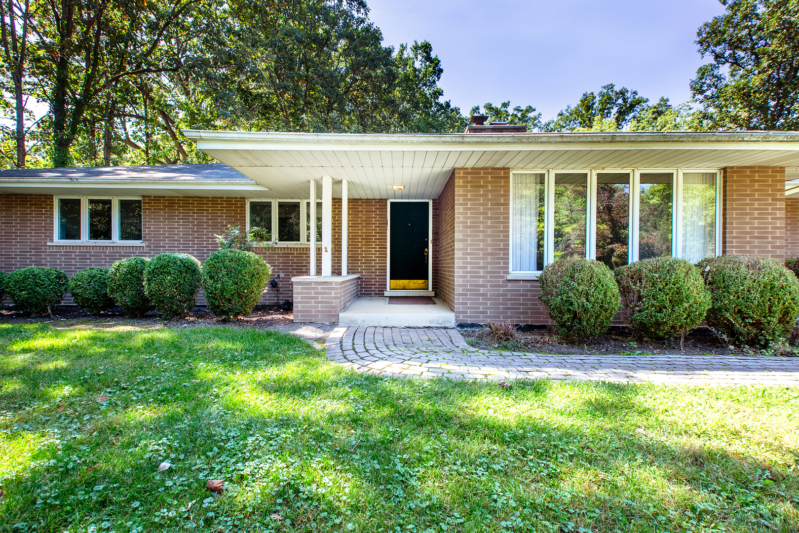 front view of a house with a yard
