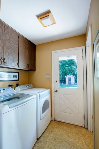 a utility room with dryer and washer
