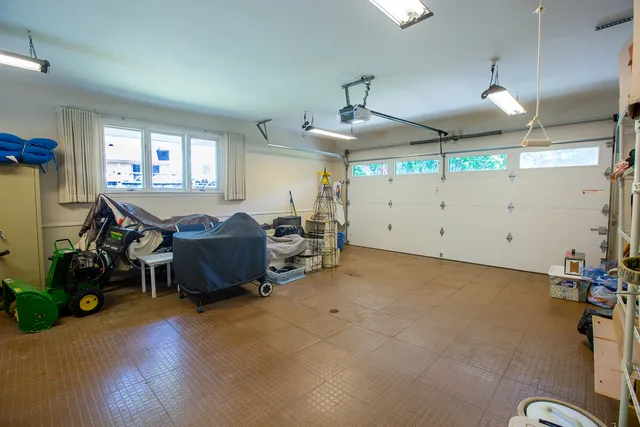 a view of a room with gym equipment and a large window