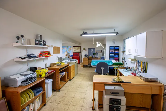 a kitchen with stainless steel appliances a stove a sink and a refrigerator